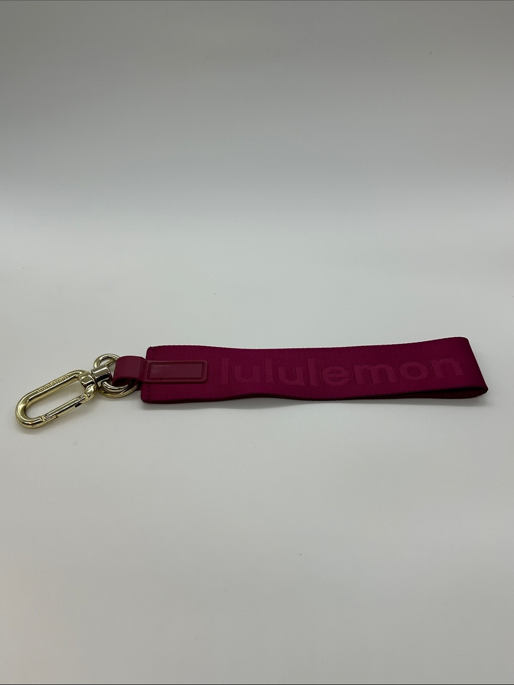 lululemon Neverlost Berry Pink Key Wristlet with Gold Clip